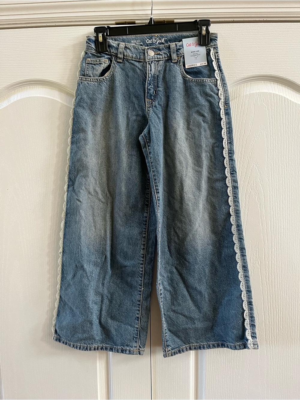 NWT Girls' Mid-Rise Lace Trim Wide
Leg Jeans - Cat & Jack